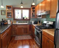 “Slow Cook” Designs Beautiful Cherry Wood Kitchen in Gustavus
